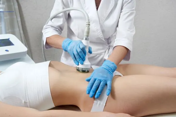 Lost the Weight but Not the Loose Skin? 2 woman having HIFU treatment on her stomach to combat loose skin Lytham St Annes following weight loss